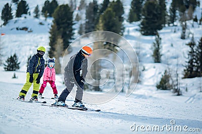 winter scene: a group of children are learning to ski Editorial Stock Photo