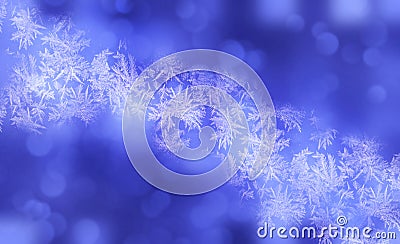Winter shiny snowflakes blurred background in light blue white colors. Blurry Christmas holiday background with snow flakes Stock Photo
