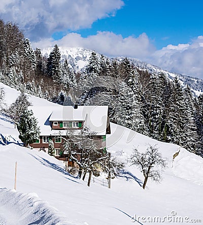 Winter ski chalet and cabin in snow mountain Stock Photo