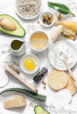 Winter skin care. Homemade natural ingredients for a nourishing face mask on a light background, top view. Stock Photo