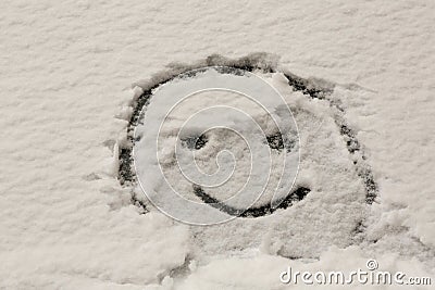 Winter smiley on the car windshield Stock Photo