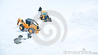 Korean winter, many white snow, icy roads, two large toy forklifts Stock Photo