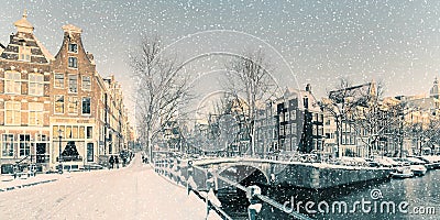 Winter snow view of a Dutch canal in Amsterdam Stock Photo