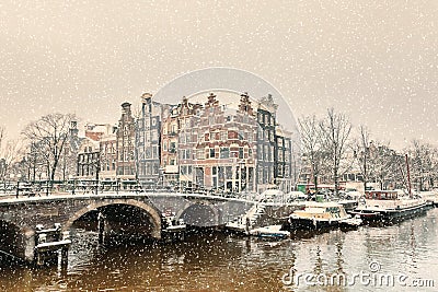 Winter snow view of a Dutch canal in Amsterdam Stock Photo