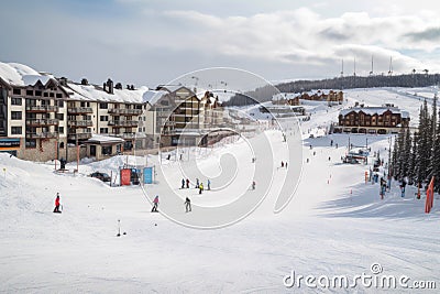 winter sports resort, with skiers and snowboarders taking advantage of the slopes Stock Photo