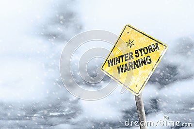 Winter Storm Warning Sign With Snowfall and Stormy Background Stock Photo