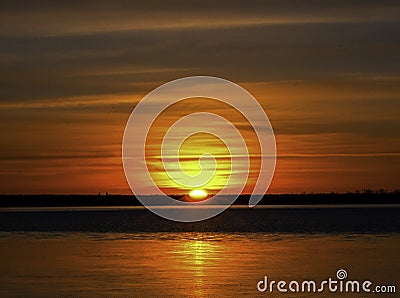 Winter Sunrise Over A Calm Colorado Lake Stock Photo