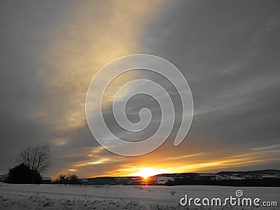 Winter Sunrise over the South Eastern hills of the Fingerlakes Stock Photo