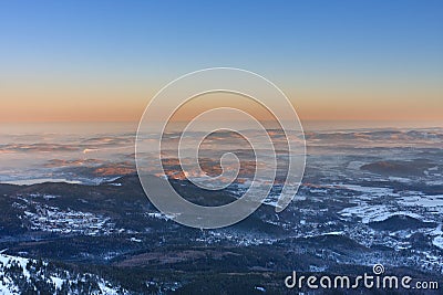 Winter, sunrise time, Karpacz view from Snezka , krkonose mountains. Snezka is mountain on the border between Czech Republic and Stock Photo