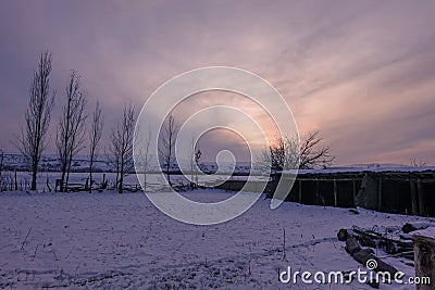 Winter sunset on a humble farmhouse Stock Photo