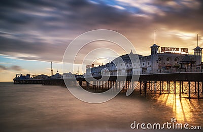 Winter sunset long exposure over Brighton pier. Stock Photo