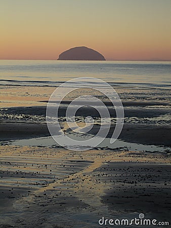 Winter sunset shot of the island of Ailsa Craig and Girvan beach, Scotland Stock Photo