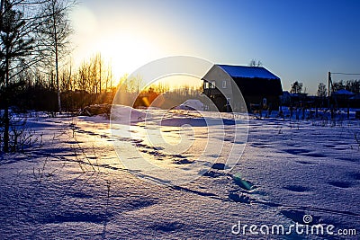 Winter sunset village in cold evening. Russian winter. Stock Photo