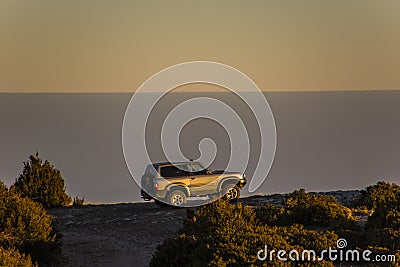 Winter sunset and 4x4 car in Serra Del Montsec, Lleida, Spain Stock Photo