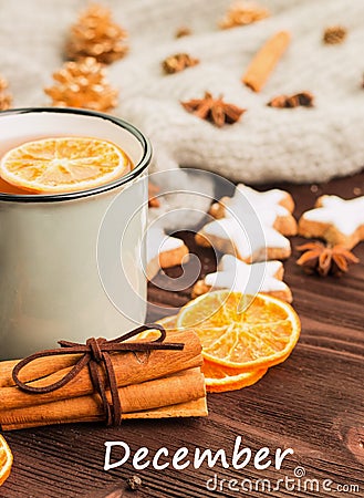 Winter theme. Cup of hot tea with spices, orange, cinnamon, anis Stock Photo