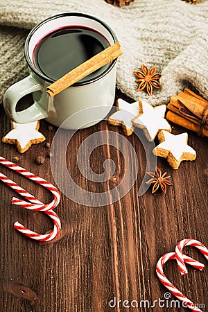 Winter theme. Hot steaming cup of glint wine with spices Stock Photo