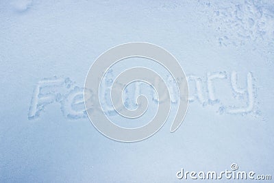 February handwritten on fresh snow Stock Photo
