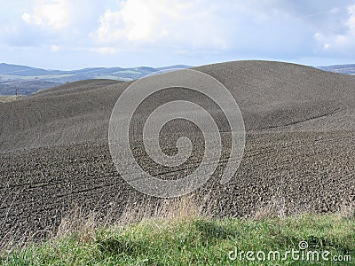 Winter Tuscany landscape with plowed fields at morning Stock Photo