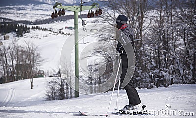 Winter vacation, winter sports, girl enjoying the view, downhill skiing, looking at the track, Montenegro, Zabljak, 2019-02-10 10: Editorial Stock Photo