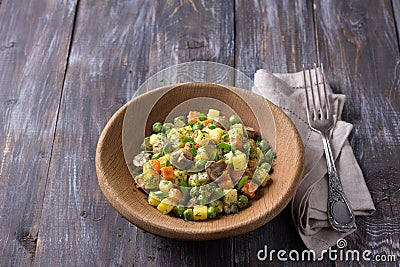 Winter vegetable vegetarian salad with mushrooms, russian salad, with homemade mayonnaise Stock Photo