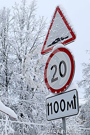 Winter view of speed limit sign on the road covered by snow Stock Photo