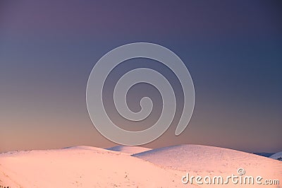Winter wallpaper. Hills in sunrise light, white edit space Stock Photo
