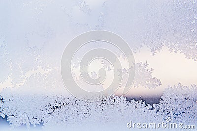 Winter Window Pane Coated Shiny Icy Frost Patterns. Close up. Winter weather Stock Photo