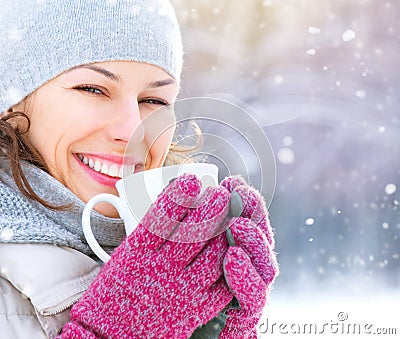 Winter woman with hot drink outdoors Stock Photo