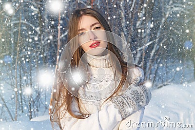 Winter woman in snow looking up at copy space outside on snowing cold winter day. Portrait multiethnic Caucasian Asian female mode Stock Photo