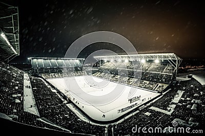 Winter Wonderland Football Field with Snow-Covered Stadium, generative AI Stock Photo