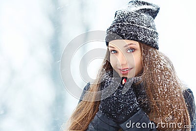 Winter young woman portrait. Beauty Joyful Model Girl laughing and having fun in winter park. Beautiful young woman Stock Photo