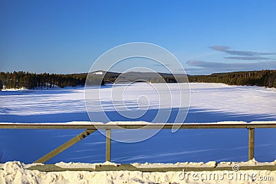 Winterly view from a bridge crossing Vindel river in northern Sweden Stock Photo