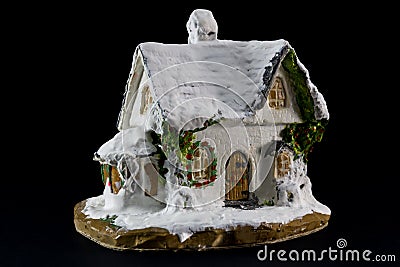 Winters christmas decoration with small toy ceramic house Stock Photo