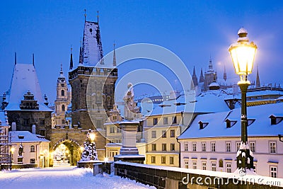 Wintertime Charles bridge, gothic Lesser Town bridge tower, Less Stock Photo