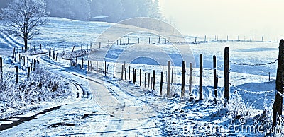 Wintry road in countryside Stock Photo