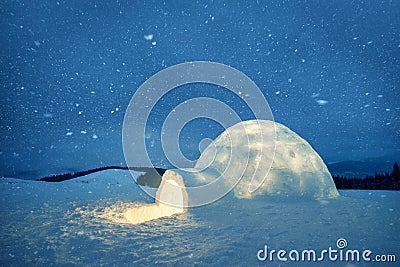 Wintry scene with resl snow igloo and milky way Stock Photo
