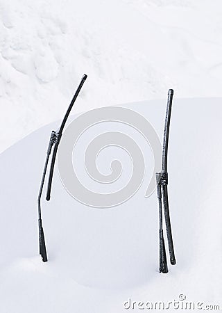 Wipers of snow covered car Stock Photo