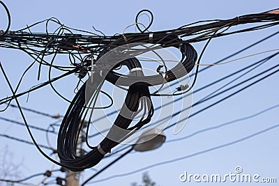 Wire assemblage a lot of cables and wires on pole in the city , Stock Photo