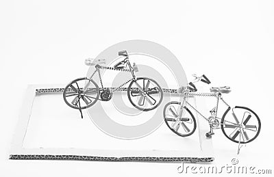 Wire bicycle model,paper frame on white background Stock Photo