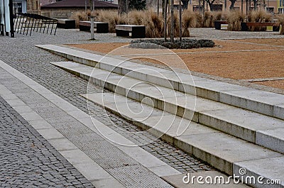 wire circular benches park furniture in winter. sintered gravel with Stock Photo