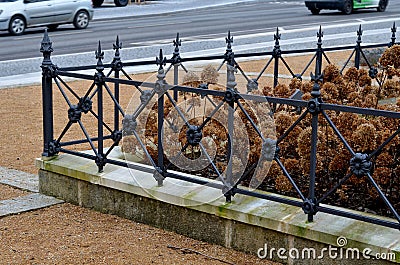 wire circular benches park furniture in winter. sintered gravel with Stock Photo