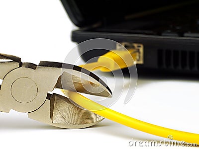 Wire cutter cutting network cable from laptop on white background Stock Photo