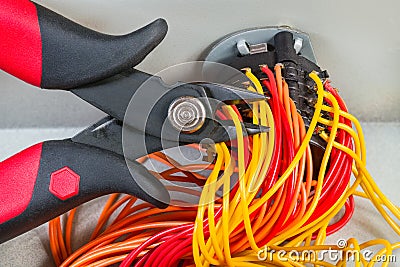Diagonal cutting pliers detail. Parallel cables on mechanic rotary switch Stock Photo