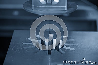 The Wire EDM machine cutting the gear shape of die insert. Stock Photo