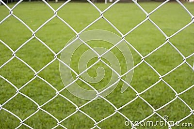 Wire Fence With Green Background Stock Photo