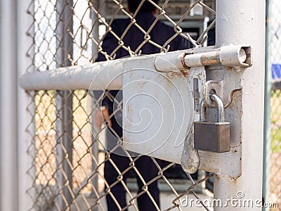 Wire fencing beside each other, the line between the road and the canal Stock Photo