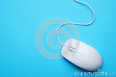 Wired computer mouse on blue background, top view. Space for text Stock Photo