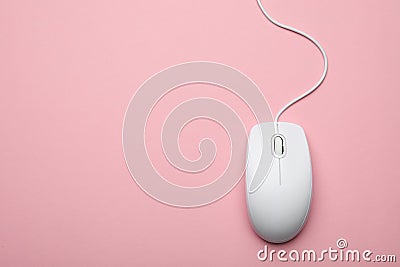 Wired computer mouse on pink background. Space for text Stock Photo