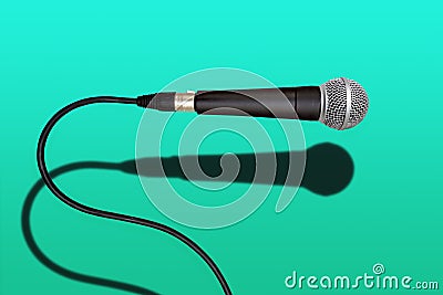 Wired singer black and grey microphone on green Stock Photo