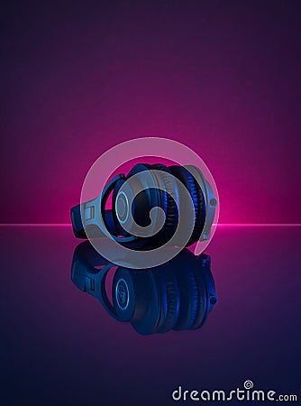 Wireless Gamer Headphones Dark Background and Neon Light. Stock Photo